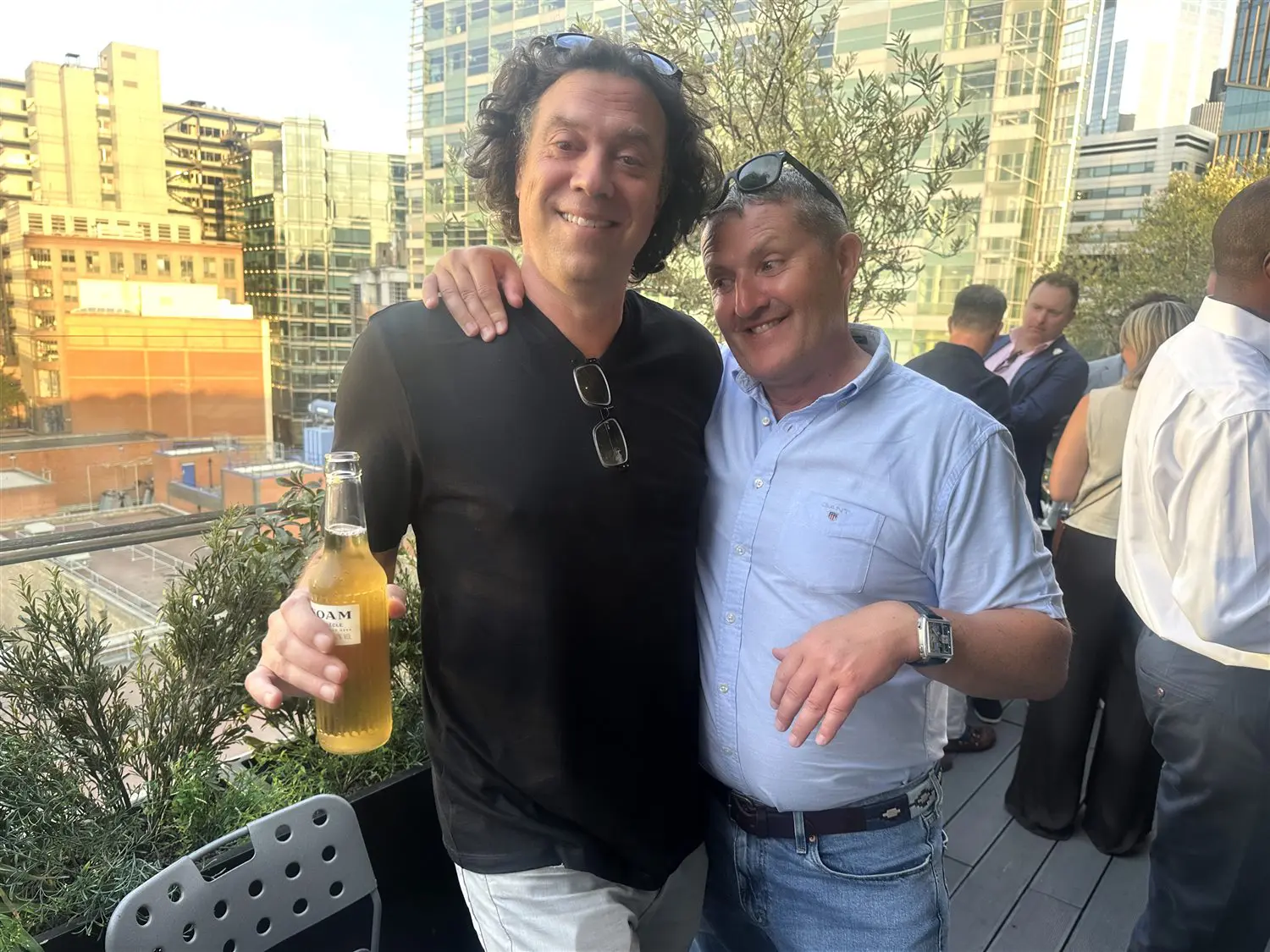 Two members together on the terrace at the Summer Party
