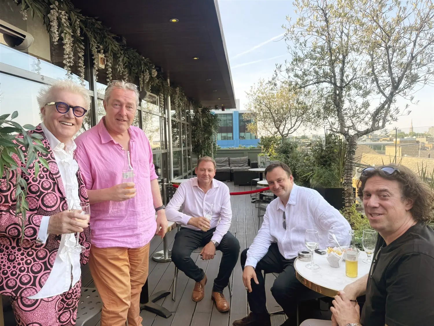 A group of members on the roof terrace in the evening sun